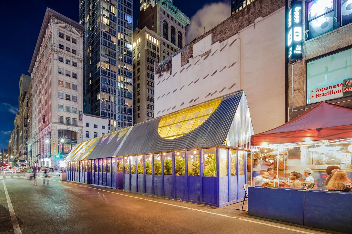 The pavilions at 32nd & 5th at blue hour, towers behind
